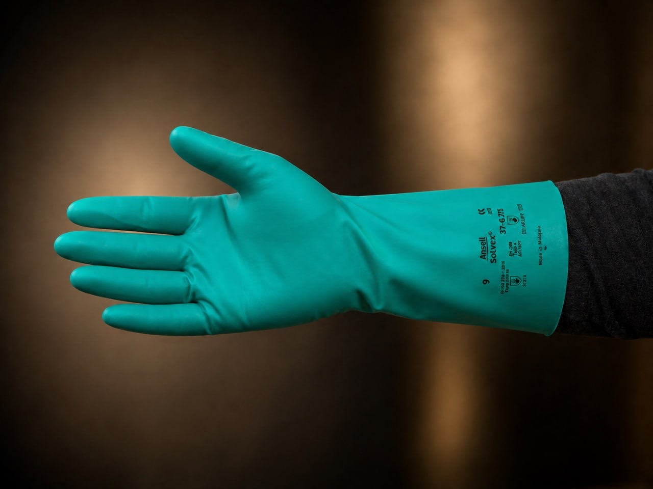 Green Ansell Solvex chemical-resistant nitrile glove for orchard mixing and loading.