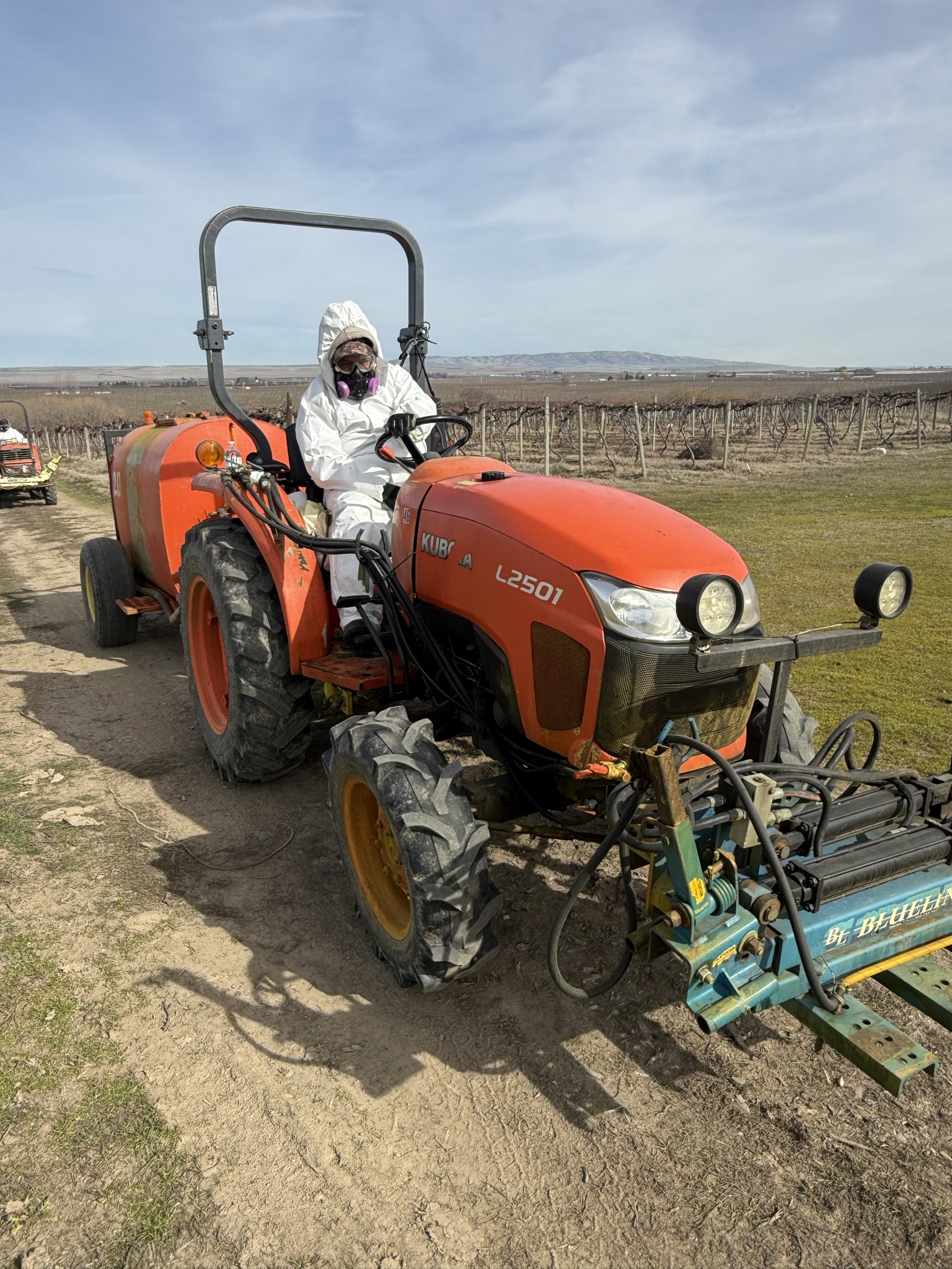 Tyler Sabin and the Yakima Valley Supply team in safety vests at a Yakima Valley hop processing facility.